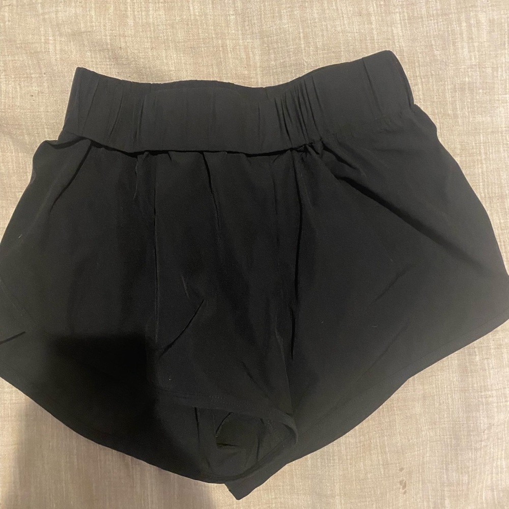 black halara dolphin fit shorts, size small